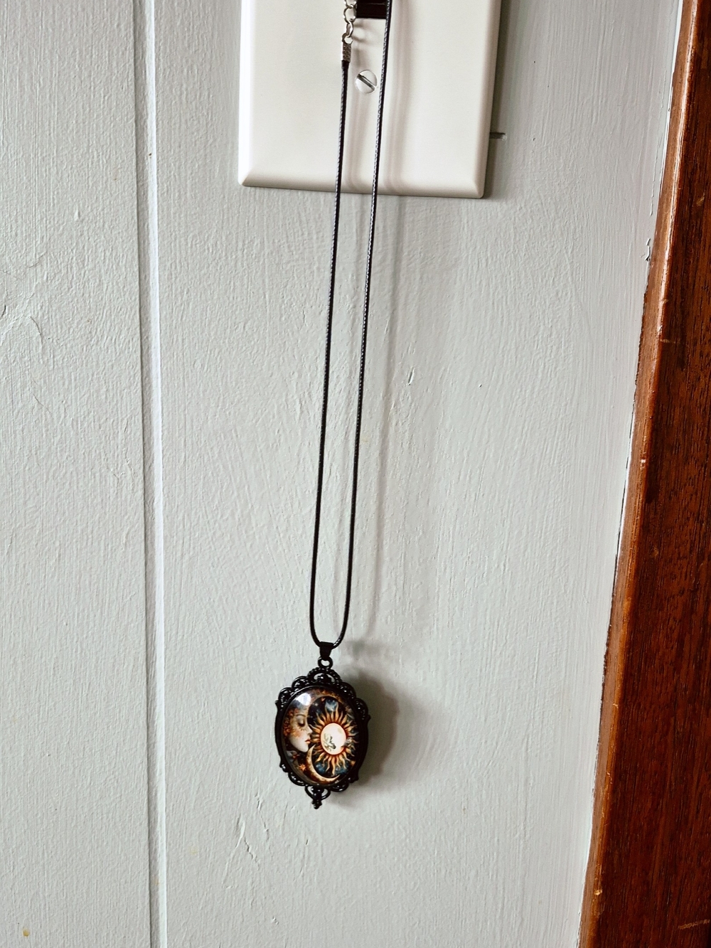 Black Sun & Moon Pendant Necklace with Ornate Frame